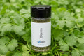 Spice container labeled 'Cilantro' on a white background